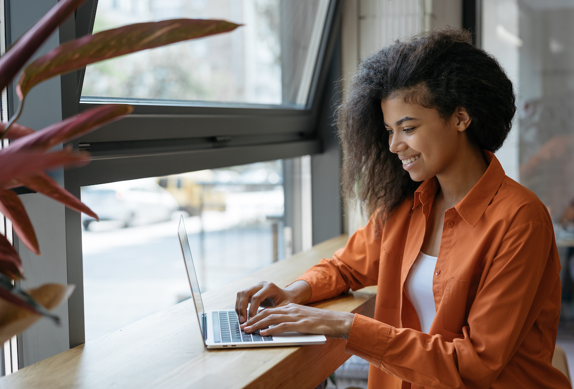 A college student at a laptop searching for career information on a laptop