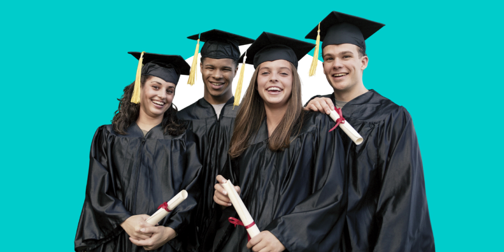 A group of graduating students in cap and gowns with diplomas in hand
