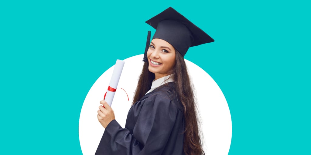A girl in cap and gown with diploma in hand, smiling