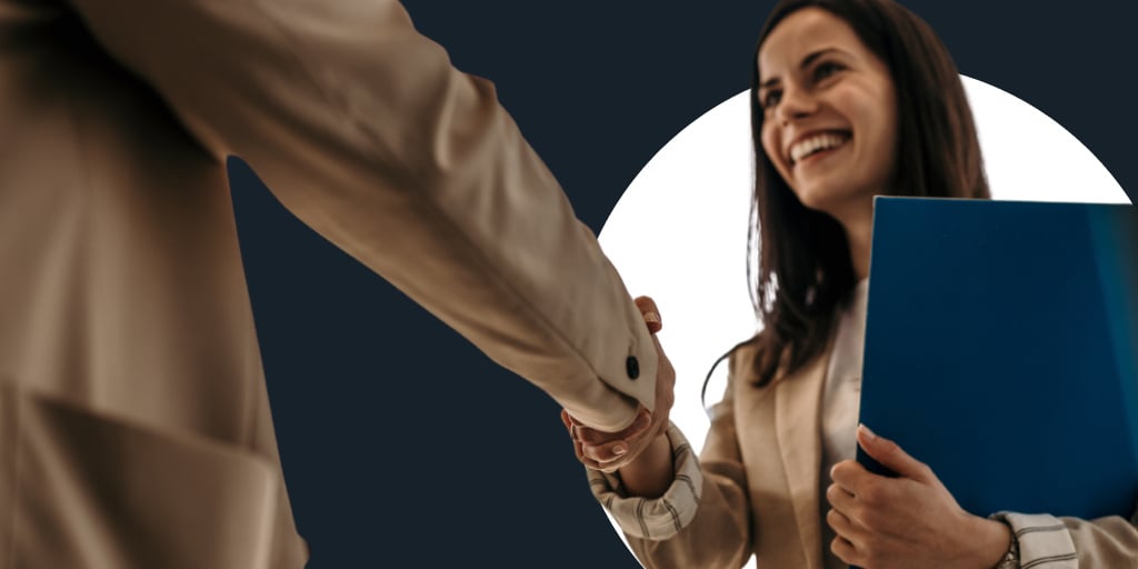 A woman shaking hands with another person