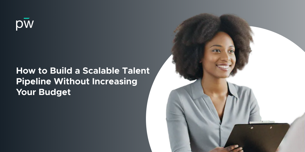 A woman smiling holding a clipboard