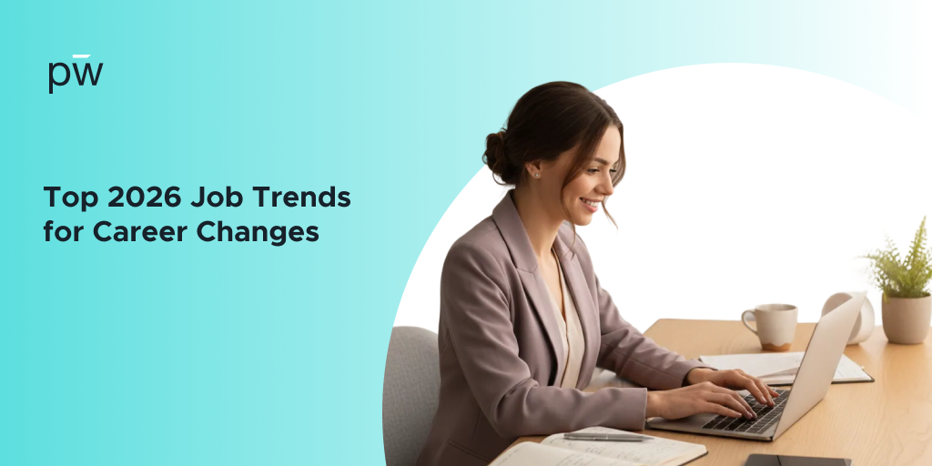 A professionally dressed worker at their desk, working on their computer