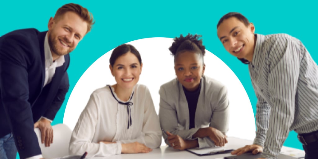 A group of diverse people standing around table