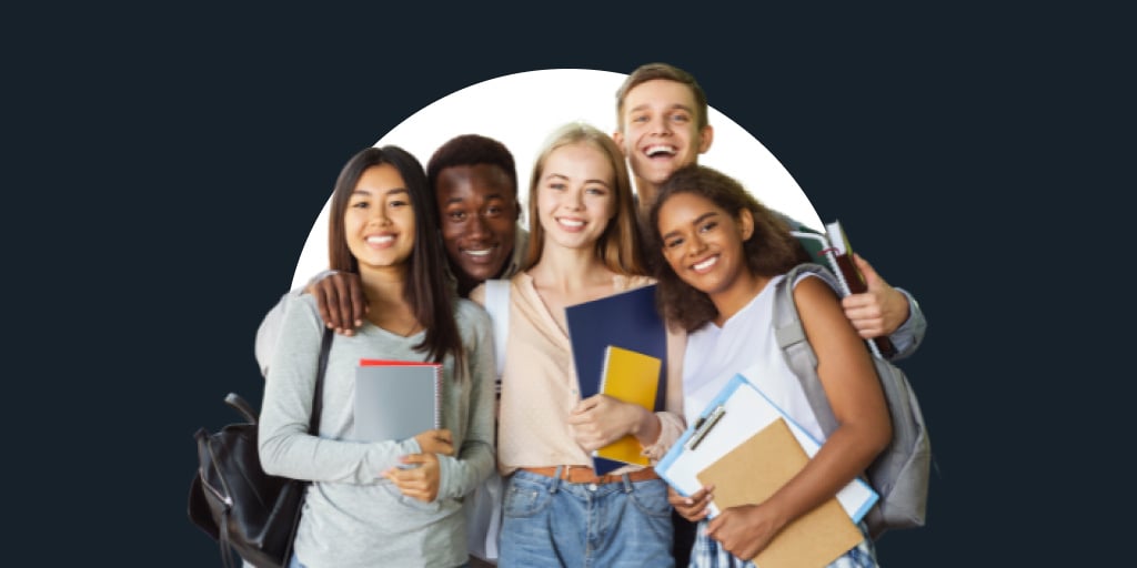 A group of people with work material standing and smiling