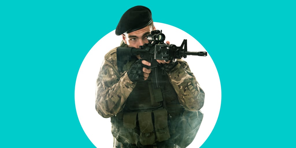 A soldier in uniform holding a weapon