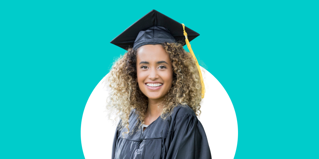 A smiling student in graduation attire, with a cap and gown