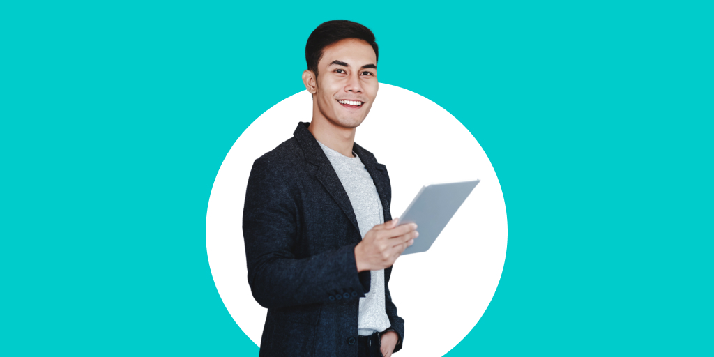 A well-dressed young person looking toward the camera while holding a tablet