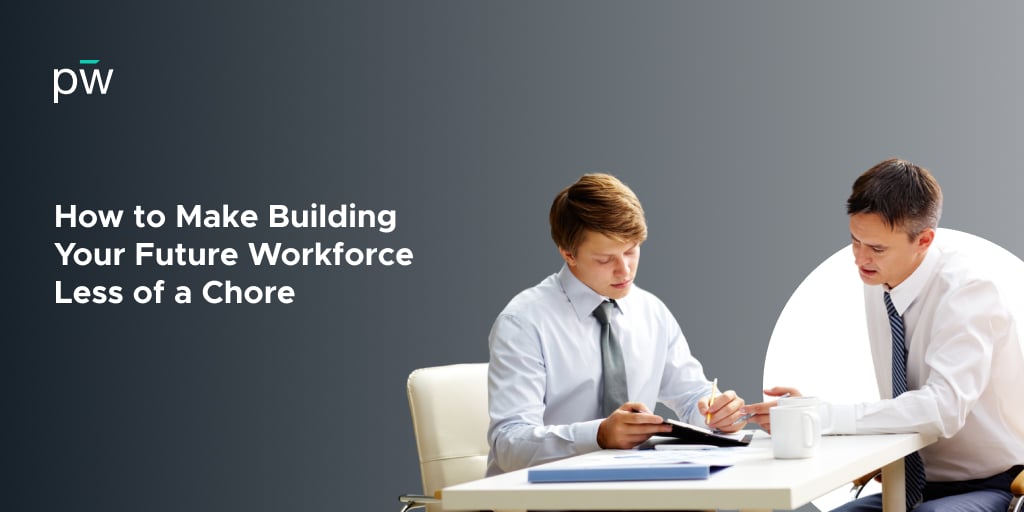 A man sitting down in a suit and tie, writing on a note pad