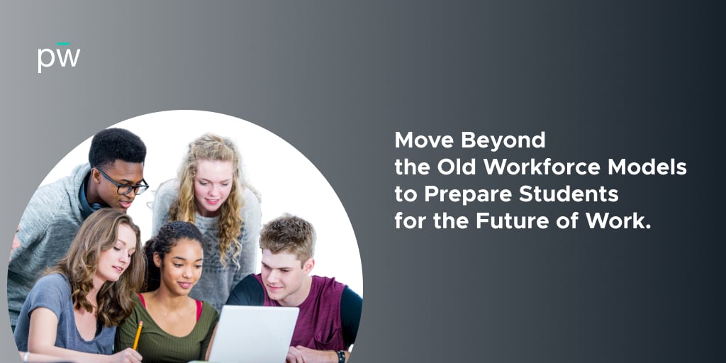 Group of young adults all gathered around a table as they work on a laptop