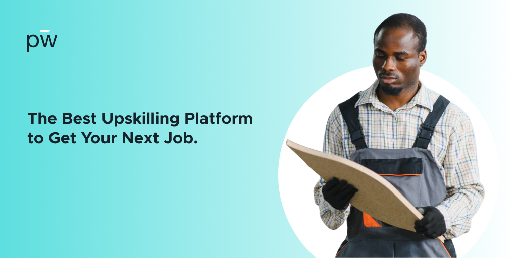 Man in overalls looking and reading something