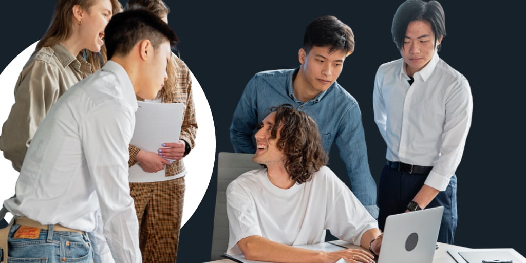 Everyone gathered around a person typing on a computer