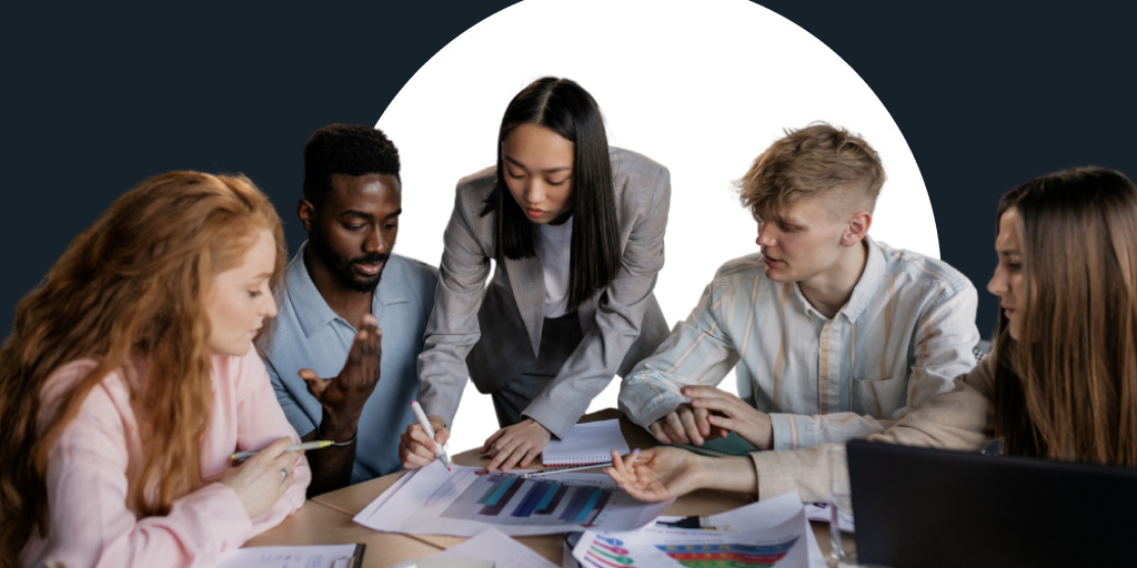 A group of teachers collaborating and working together at a table